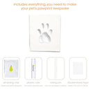 Pet pawprint keepsake kit with air-drying clay, plastic ruler, rolling pin, and double-sided tape on a white background.
