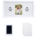 White photo frame with paw prints and a dog photo on a white background