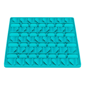 Turquoise silicone mold tray on a white background