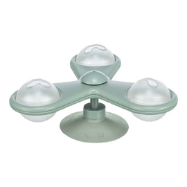 Green silicone ice cube tray with four round compartments on a white background