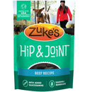 Zuke's Hip & Joint dog food package with a woman and dog in the background