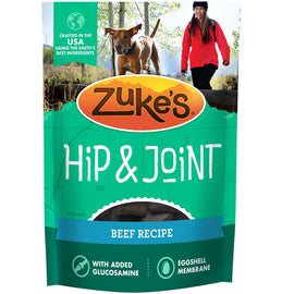 Zuke's Hip & Joint dog food package with a woman and dog in the background