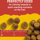 Dog treats on a yellow surface with text about training rewards and quick snacking moments.