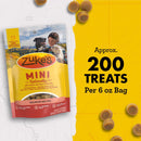 Zuke's Mini Naturals dog treat package with text about quantity on a yellow background