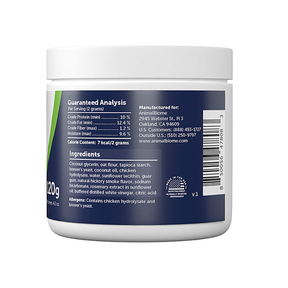 Back label of a protein powder container with text and a barcode on a white background