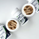 DoggyBiome pet supplement bottles with capsules on a white background