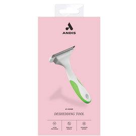 Andis at-home deshedding tool packaging on a pink background