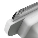 Close-up of a metallic object with a textured surface on a white background