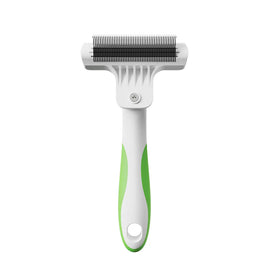 Pet grooming brush with green handle on a white background