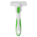 Pet grooming tool with green handle and white head on a white background