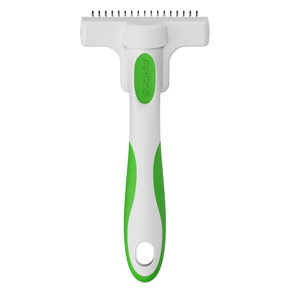 Pet grooming tool with green handle and white head on a white background