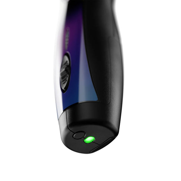 Close-up of a black and purple electronic device with a green light on a white background