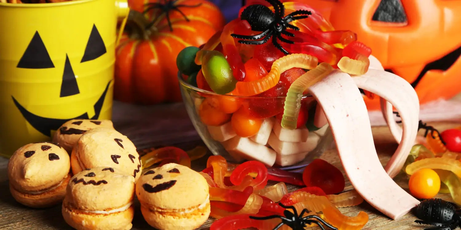 candy & other halloween treats on a wooden table