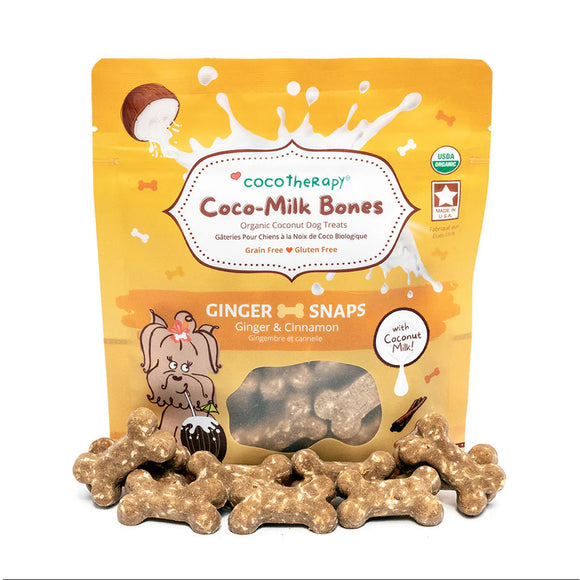 Packaging of Coco-Milk Bones ginger snaps dog treats with visible treats in front