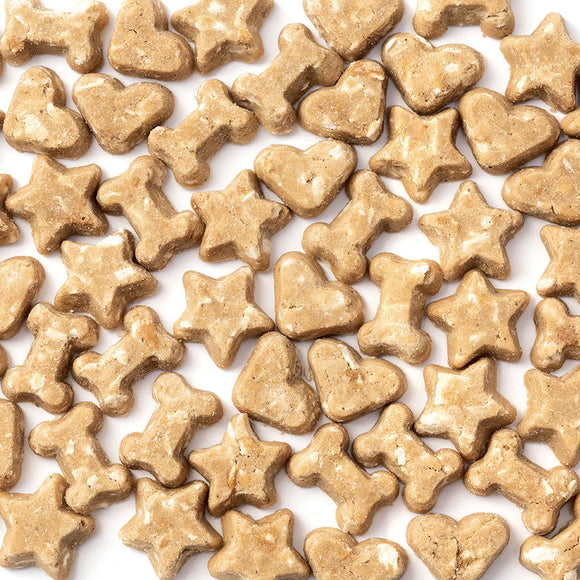 Dog treats shaped like stars and hearts on a white background