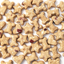 Assorted dog treats shaped like stars, bones, and hearts on a white background