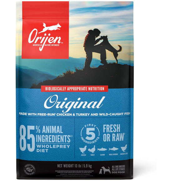 Orijen dog food package with a silhouette of a person and dog on a mountain