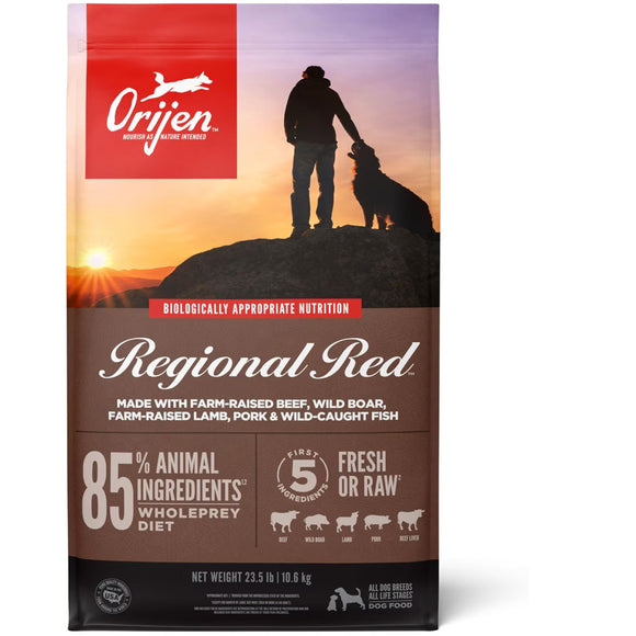 Orijen Regional Red dog food package with a sunset silhouette of a person and dog on a rock.
