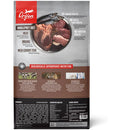 Orijen dog food package with images of raw meat and fish on a gray background