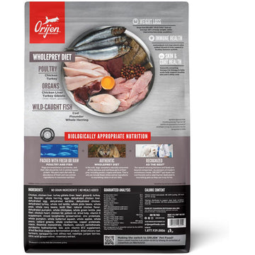 Orijen pet food package with a plate of raw meat and fish on a gray background