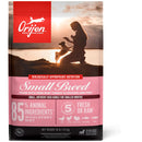 Orijen dog food package with a silhouette of a woman and dog at sunset.