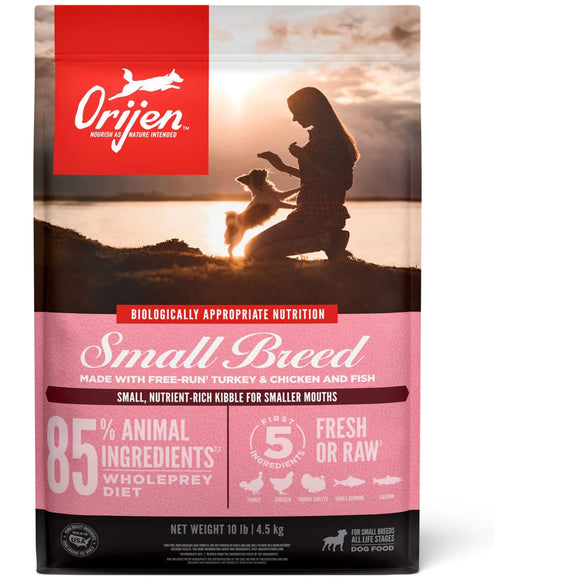 Orijen dog food package with a silhouette of a woman and dog at sunset.