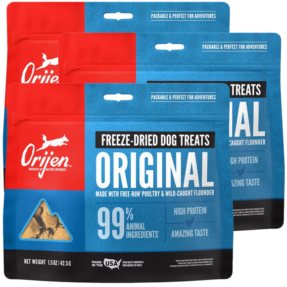Orijen freeze-dried dog treats packaging in red and blue.