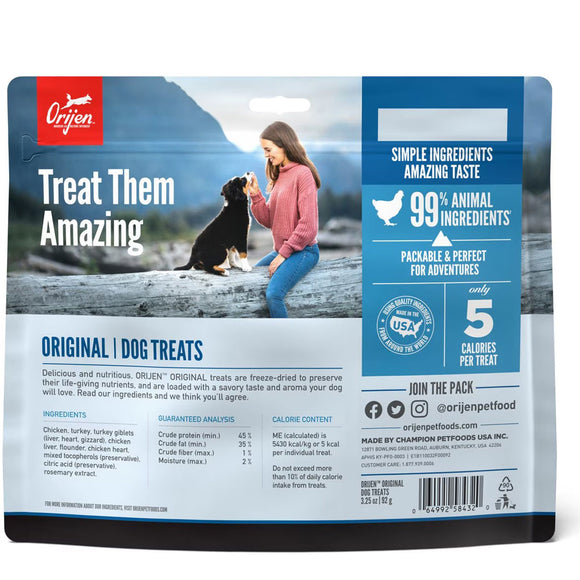 Orijen dog treats packaging with a woman and dog on a mountain background