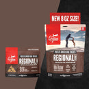 Orijen Regional Fresh freeze-dried dog treats packaging with a person and dog illustration on a mountain background.