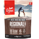 Orijen Regional Red freeze-dried dog treats packaging with a scenic background