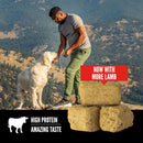 Man and dog on a mountain with stacked blocks and promotional text overlay