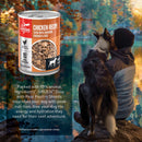 Orijen dog food can with a scenic background of a person and dog by a lake.