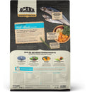 Back view of an Acana pet food package with text and images of fish and vegetables.