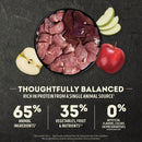 Raw meat in a bowl with apples on a dark background, featuring nutritional information.