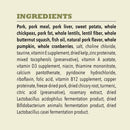List of ingredients for a pet food product on a beige background