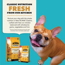 Acana Classics dog food packaging with a smiling dog on a blue background