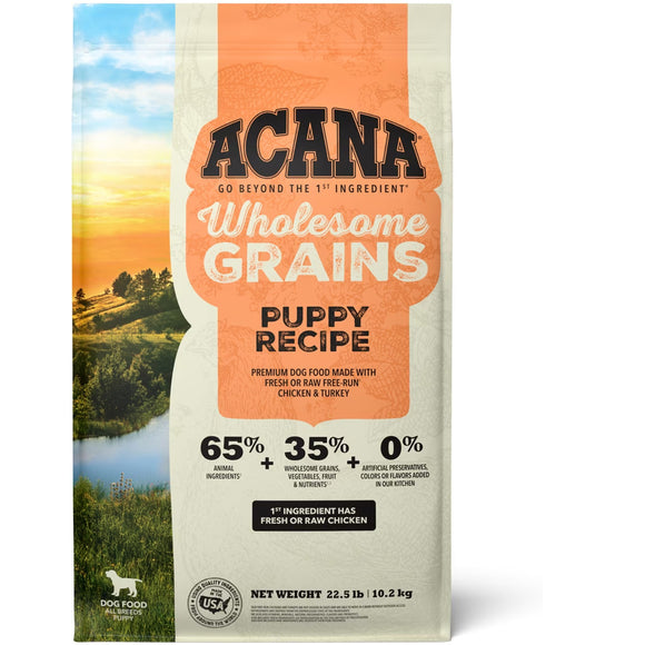Acana Wholesome Grains Puppy Recipe dog food package with a scenic background