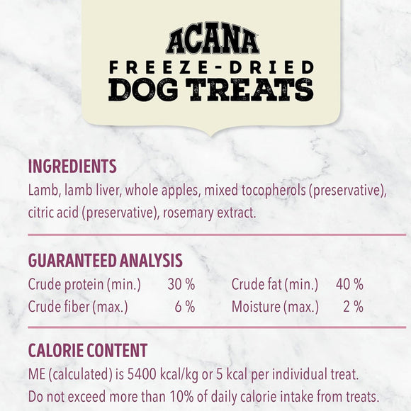 Acana freeze-dried dog treats label with ingredients, guaranteed analysis, and calorie content on a marble background.