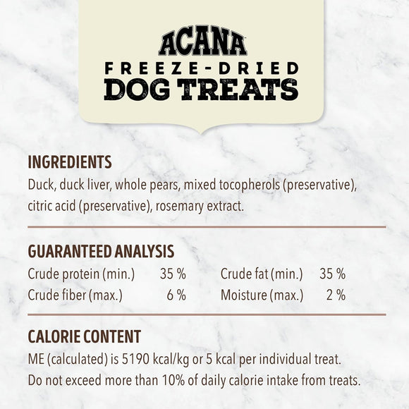 Acana freeze-dried dog treats label with ingredients, guaranteed analysis, and calorie content on a marble background.