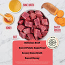 Dog food ingredients including beef, bone broth, sweet potato, and honey on a marble background.