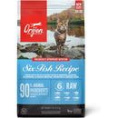 Orijen cat food package with a cat on a rock by a lake