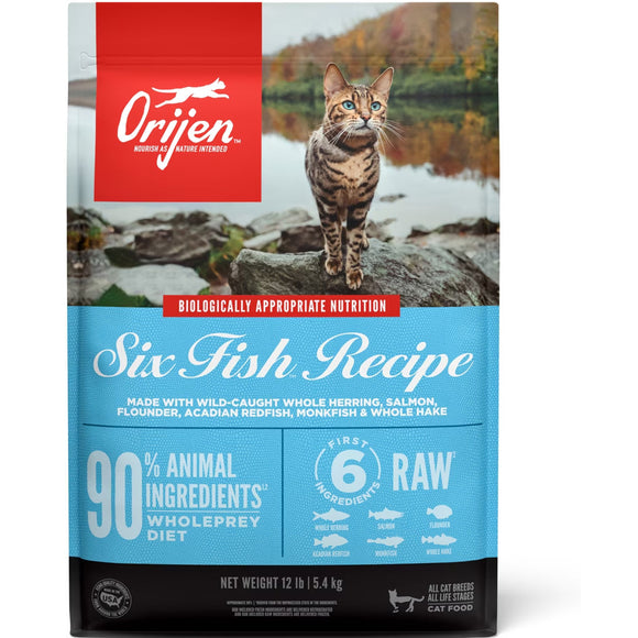 Orijen cat food package with a cat on rocks by a lake
