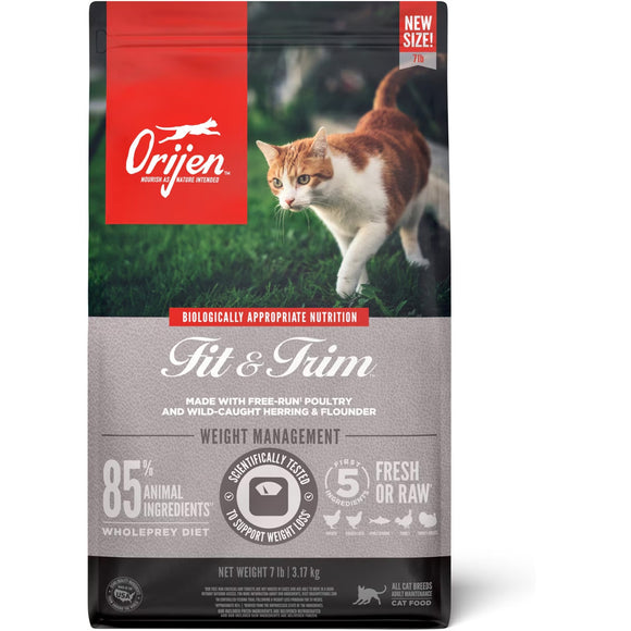 Orijen Fit & Trim cat food package with a cat on grass