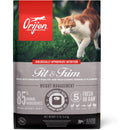 Orijen Fit & Trim cat food package with a cat on grass