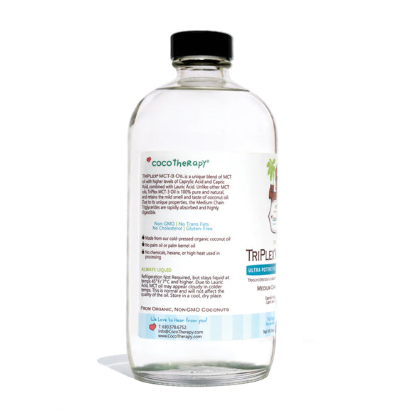 Clear bottle with black cap labeled 'Coco Therapy' on a white background