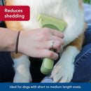 Person using a green pet grooming brush on a dog with text indicating benefits
