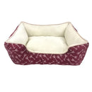 Pet bed with maroon fabric and white arrow pattern on a white background
