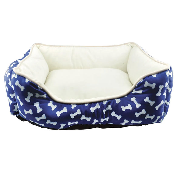 Dog bed with blue bone pattern and white interior on a white background