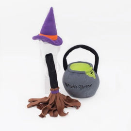 Halloween-themed dog toy set with witch hat, broomstick, and cauldron on a white background