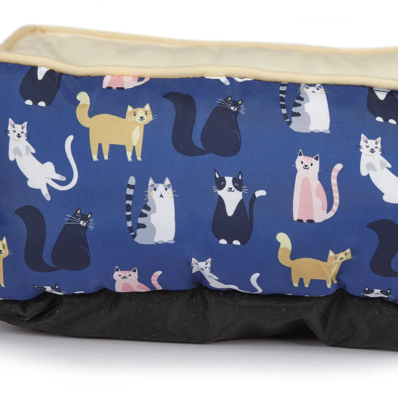 Rectangular pet bed with cat pattern on a blue background